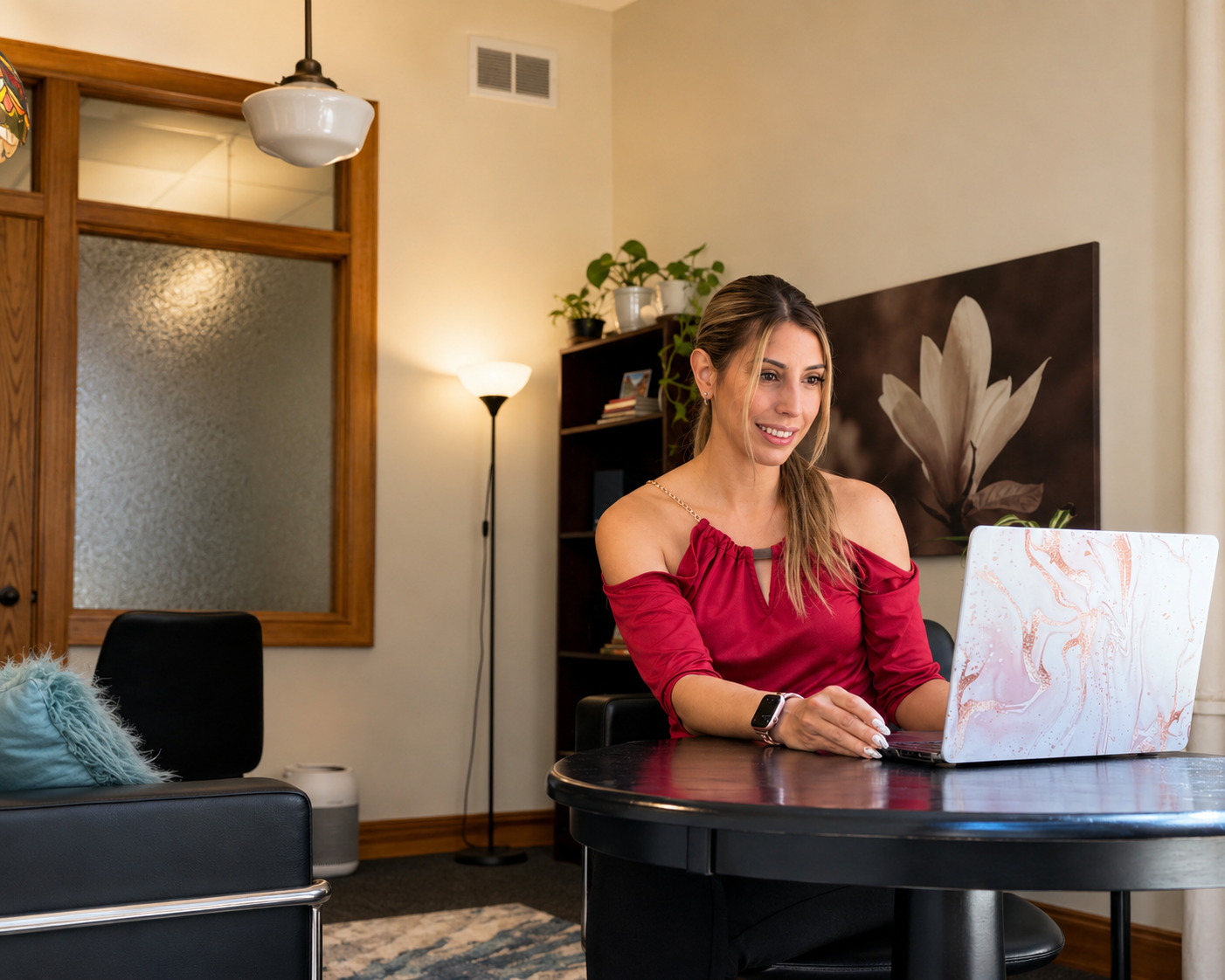 Andrea Santiago, clinical director at therapy chicago Gemstone Wellness, at her desk.