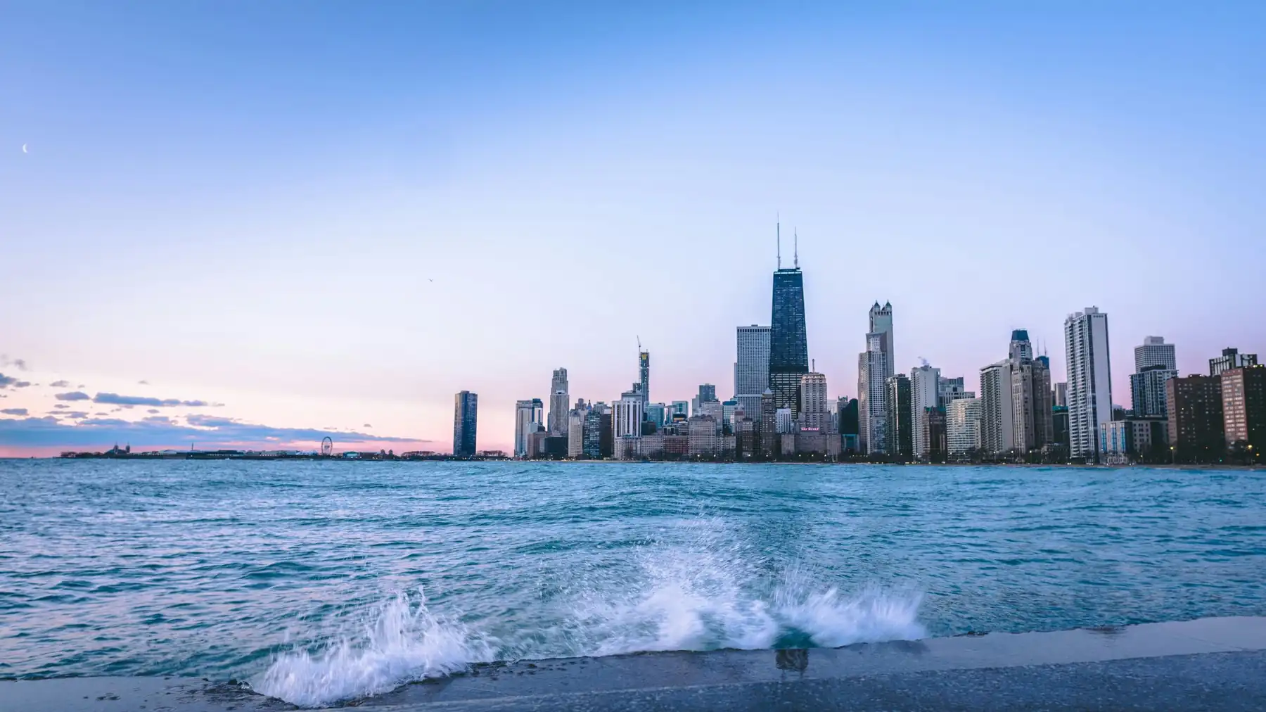 The downtown Chicago skyline during sunrise overlooking Lake Michigan.
